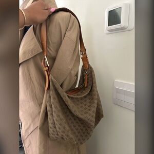 Authentic Dooney & Bourke hobo bag. Light brown, signature canvas print.
